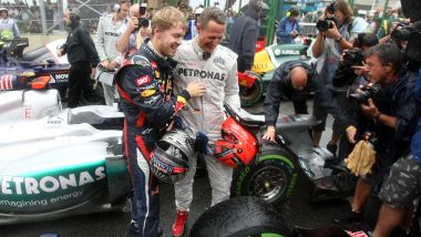 F1, GP Brasile 2012: Sebastian Vettel (Red Bull) con Michael Schumacher (Mercedes)